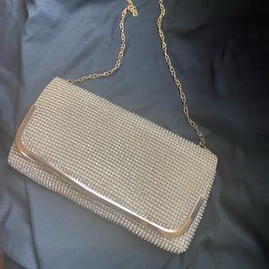 Gold evening clutch bag with chain strap